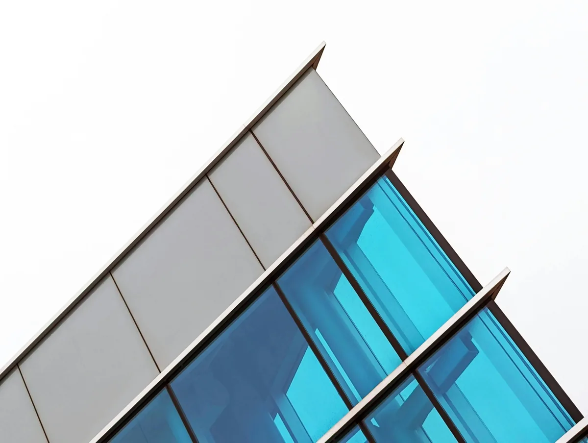 Modern building facade with clean glass windows and metal framing detail