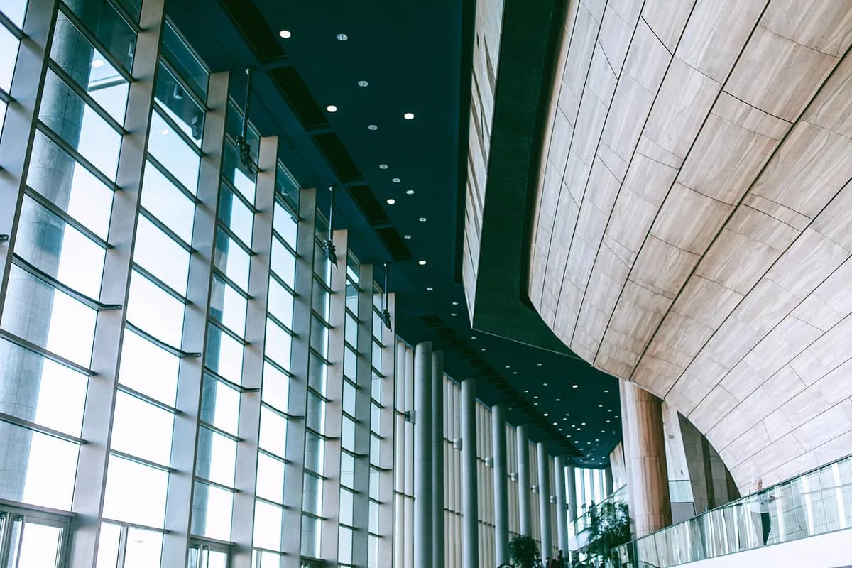 Modern building interior with expansive gridded windows and clean glass facade