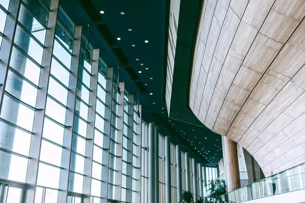 Modern building interior with expansive gridded windows and clean glass facade