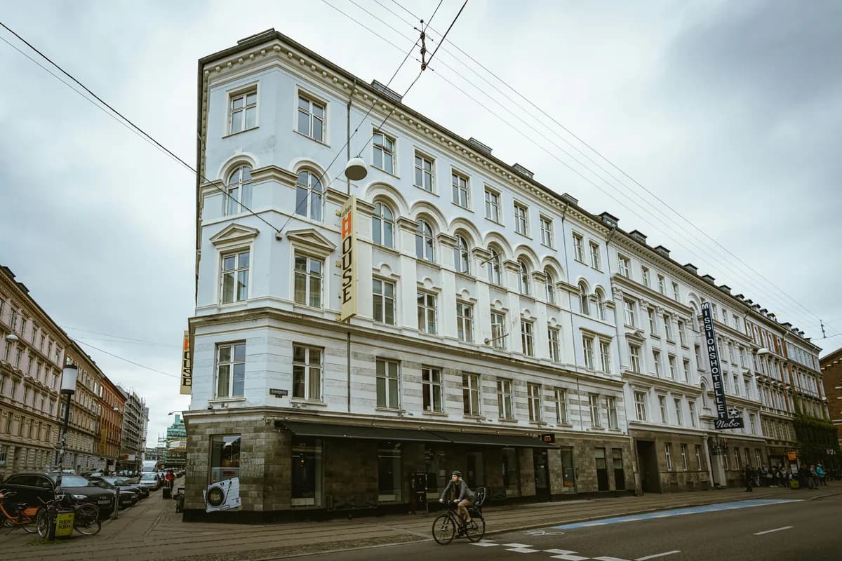 Historic multi-story building with classical arched windows and stone facade