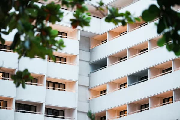 Modern residential apartment building with multiple floors and balconies