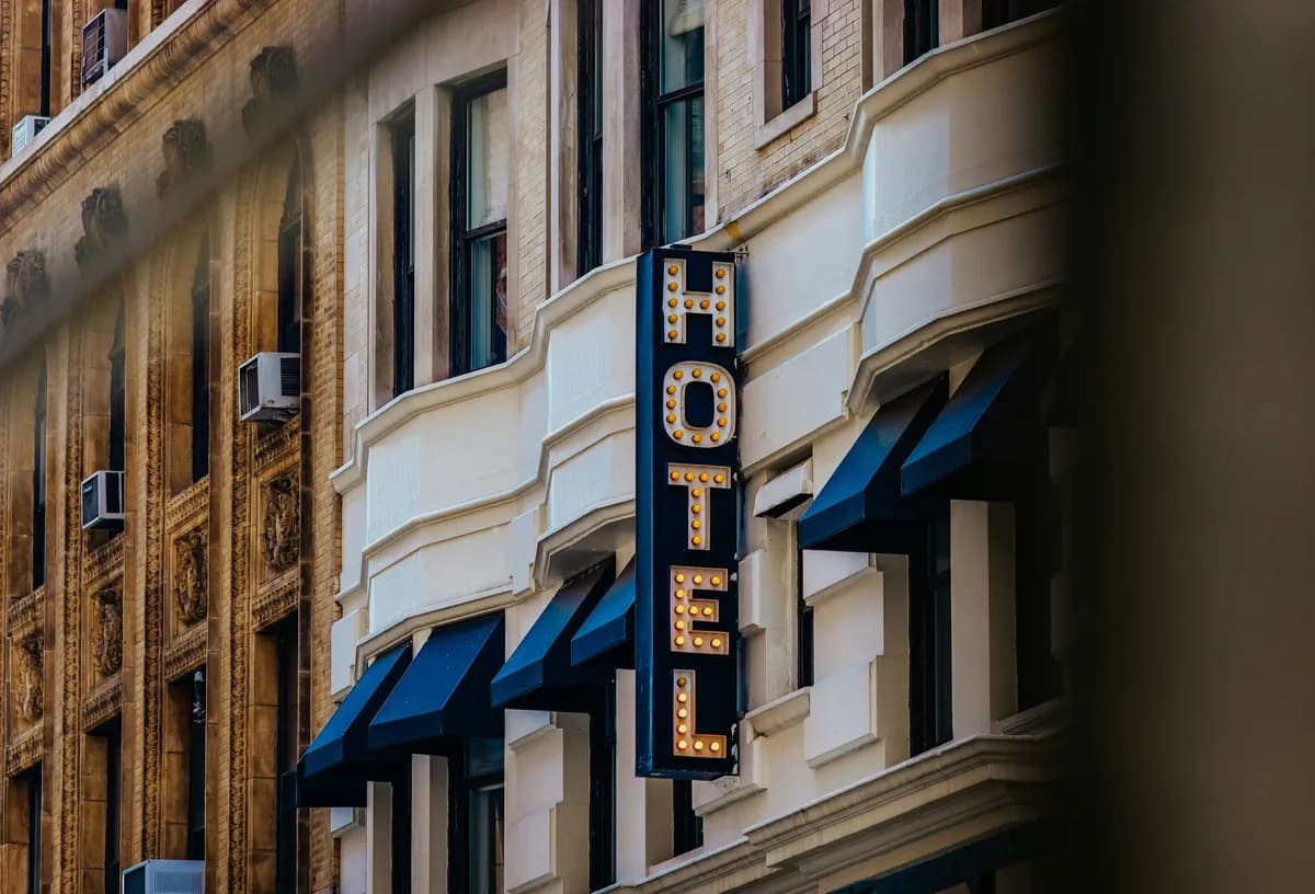 Vintage theater marquee with illuminated letters on historic building facade