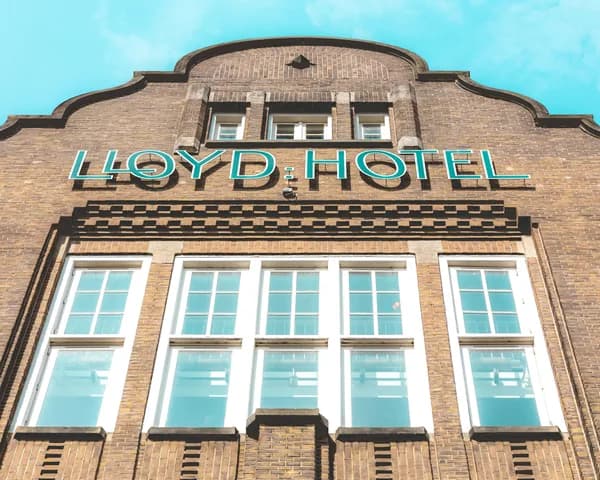 Brick building facade with large windows and decorative architectural details