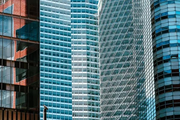Modern high-rise office buildings with reflective glass and metal facades