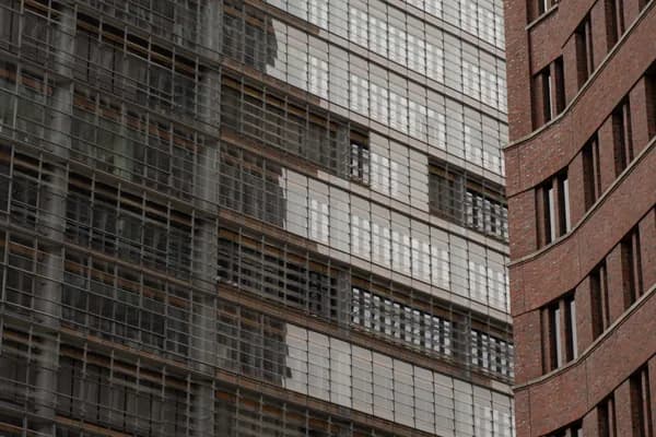 Modern building exterior with extensive glass windows and brick facade