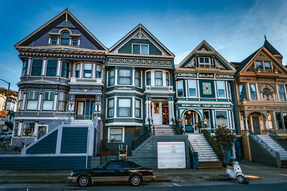 Row of Victorian houses with ornate architectural details and large windows