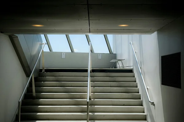 Modern stairwell with skylights and metal railings in contemporary building