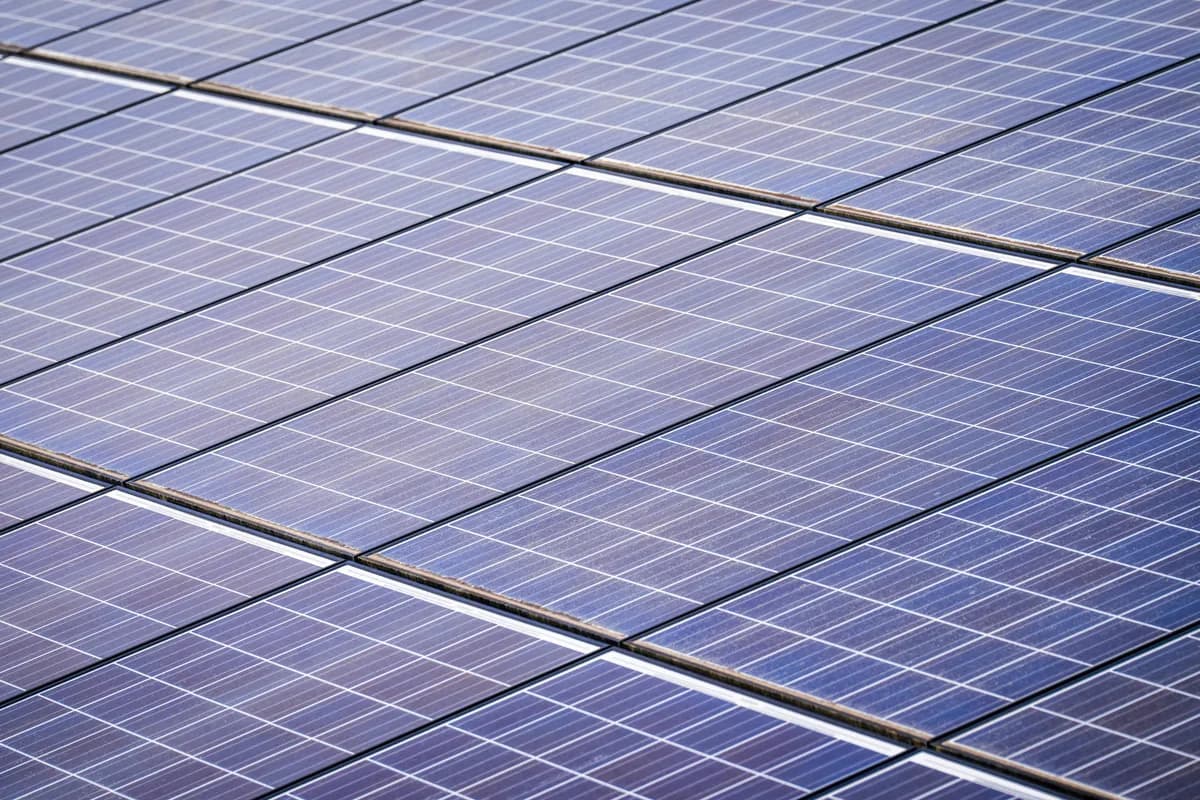 Close-up view of installed solar panels with grid pattern and metal frames